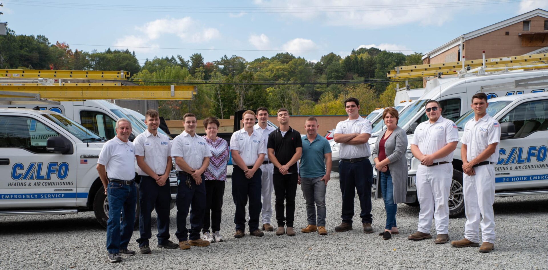 calfo team standing with their vehicle fleet in pittsburgh pa